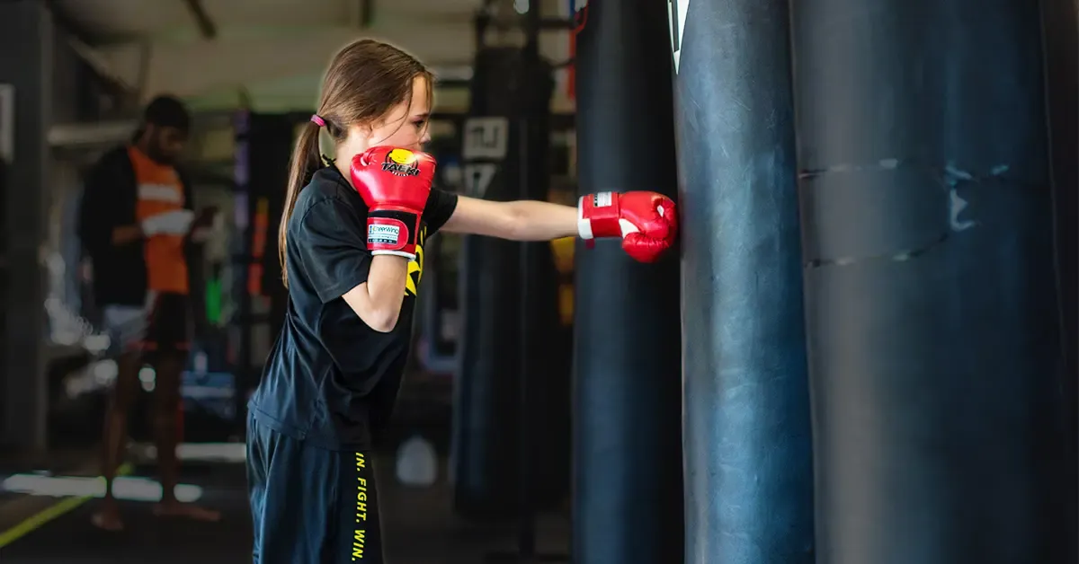 Kids learning self defense through martial arts training at Train Fight Win